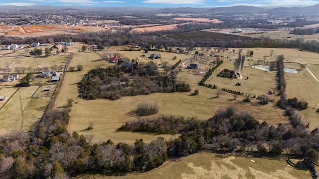 aerial view featuring a rural view and a mountain view