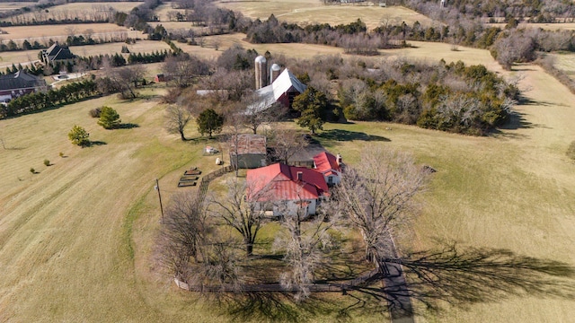 birds eye view of property with a rural view