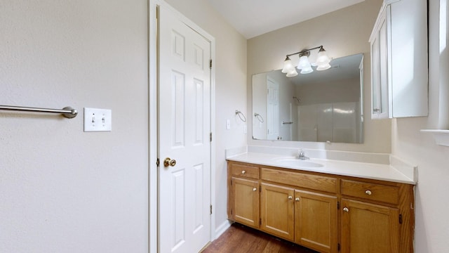 bathroom featuring hardwood / wood-style flooring and vanity