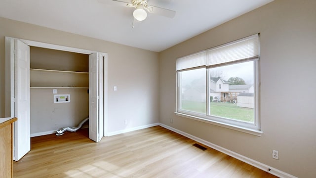 unfurnished bedroom featuring a closet, ceiling fan, and light hardwood / wood-style flooring