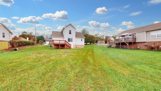 view of yard with a wooden deck