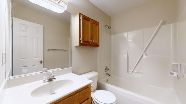 full bathroom featuring vanity, bathing tub / shower combination, and toilet