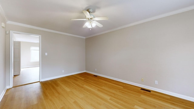 unfurnished room featuring crown molding, ceiling fan, and light wood-type flooring