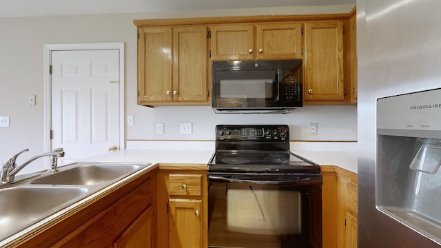 kitchen featuring sink and black appliances