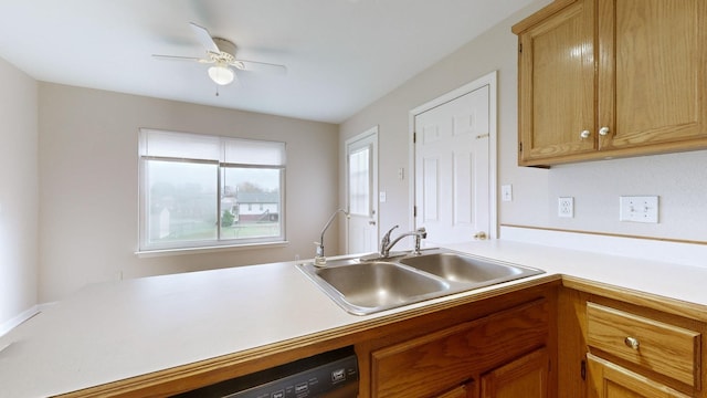 kitchen featuring ceiling fan, black dishwasher, and sink