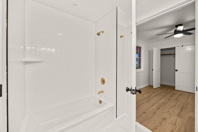 bathroom featuring tiled shower / bath, hardwood / wood-style floors, and ceiling fan