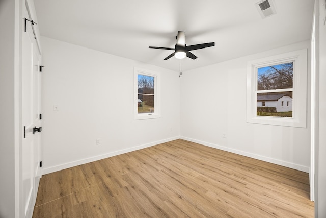 spare room featuring ceiling fan and light wood-type flooring