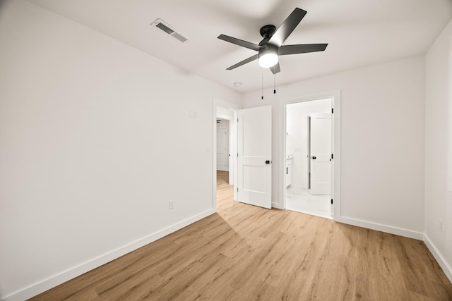 unfurnished bedroom featuring ceiling fan, connected bathroom, and light hardwood / wood-style floors