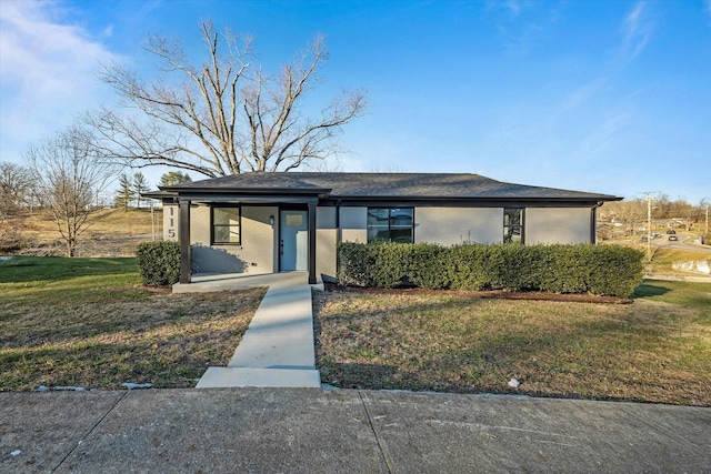 view of front of home with a front lawn