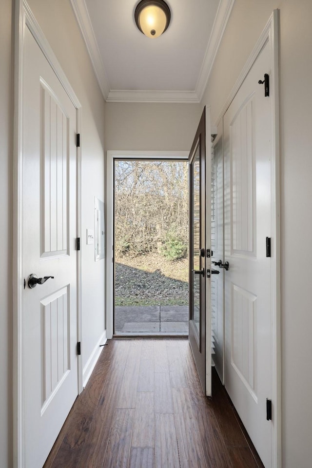 entryway featuring dark hardwood / wood-style flooring, crown molding, and electric panel