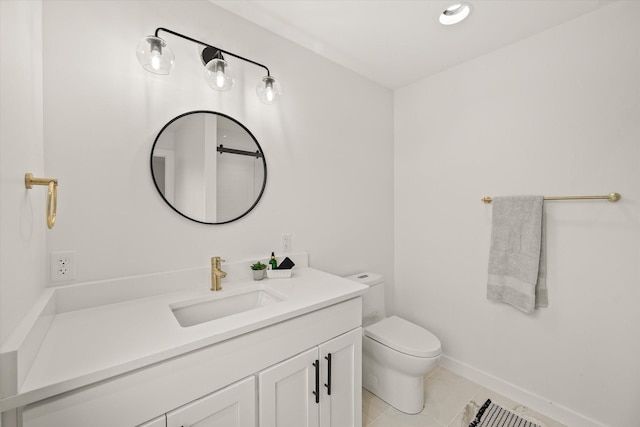 bathroom featuring vanity, tile patterned floors, and toilet