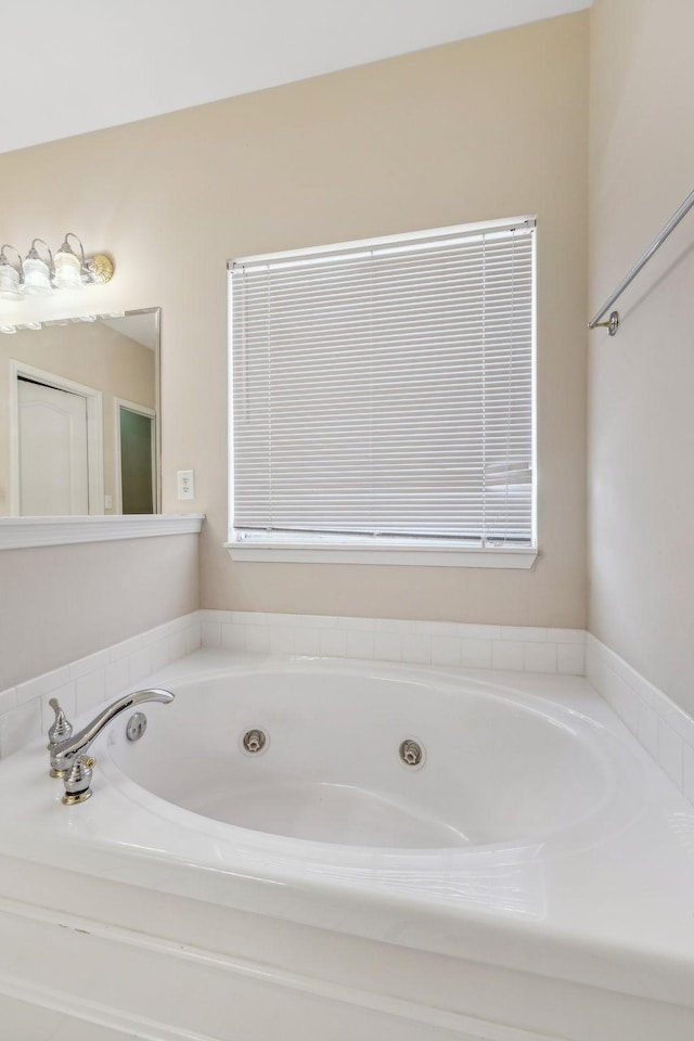 bathroom with tiled bath