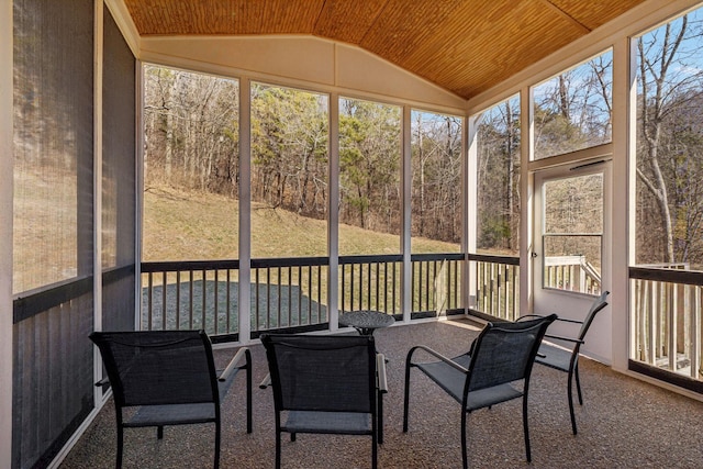 sunroom with lofted ceiling and wooden ceiling