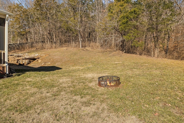 view of yard with an outdoor fire pit