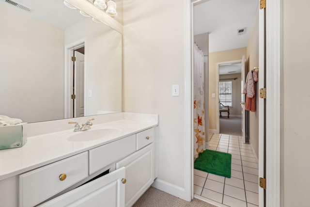 bathroom with vanity and tile patterned flooring