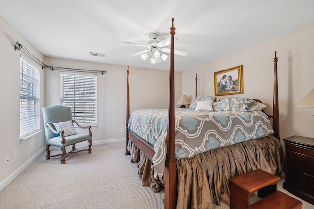 bedroom featuring light colored carpet and ceiling fan