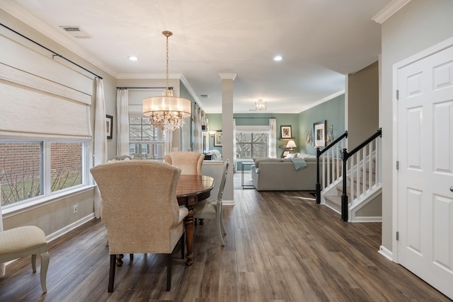 dining area with crown molding, dark hardwood / wood-style floors, and a notable chandelier