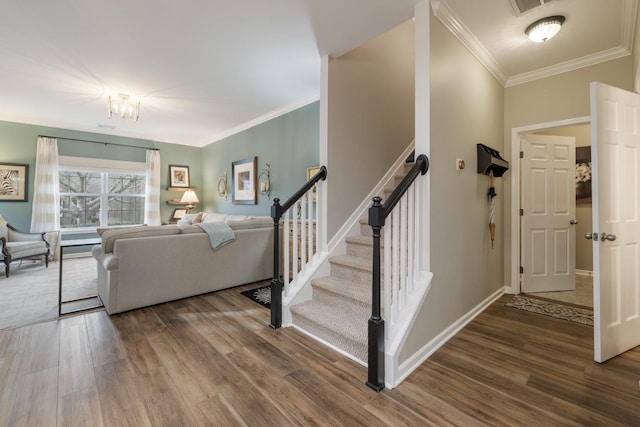 living room featuring wood-type flooring and ornamental molding