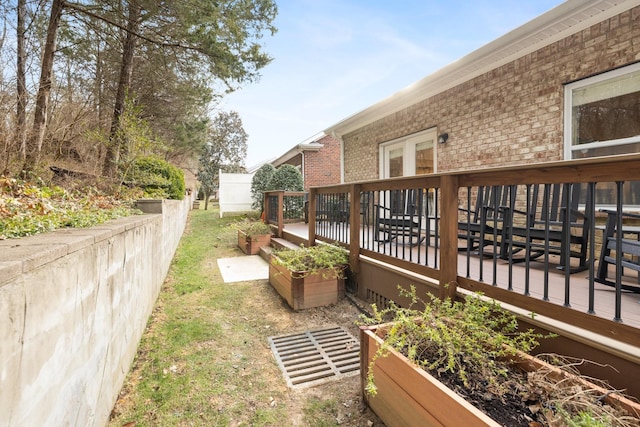 view of yard with a wooden deck