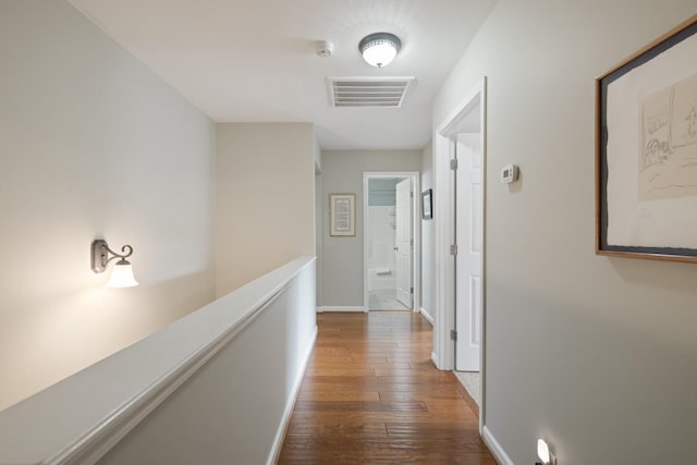 hall with hardwood / wood-style floors