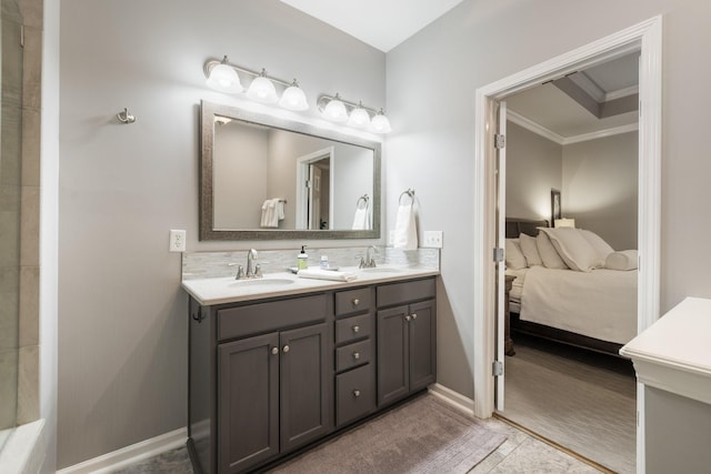 bathroom featuring ornamental molding, vanity, and backsplash