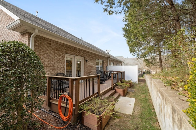 view of side of property with a deck