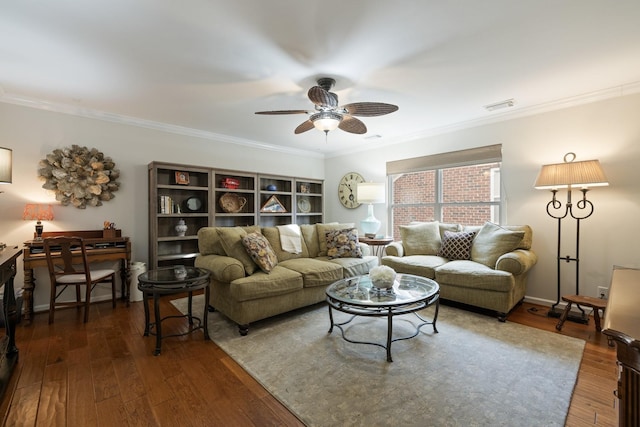 living room with crown molding, dark wood-type flooring, and ceiling fan