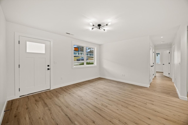 entryway with light hardwood / wood-style flooring