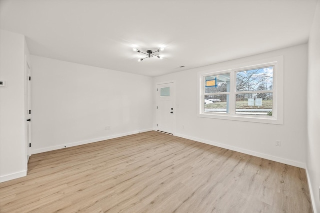 spare room featuring light hardwood / wood-style flooring