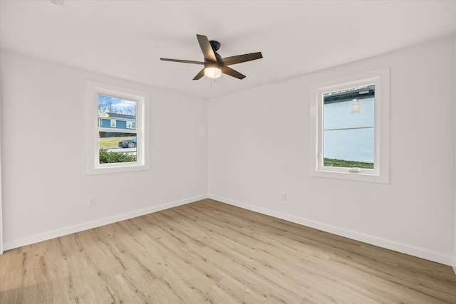 spare room featuring ceiling fan and light hardwood / wood-style floors