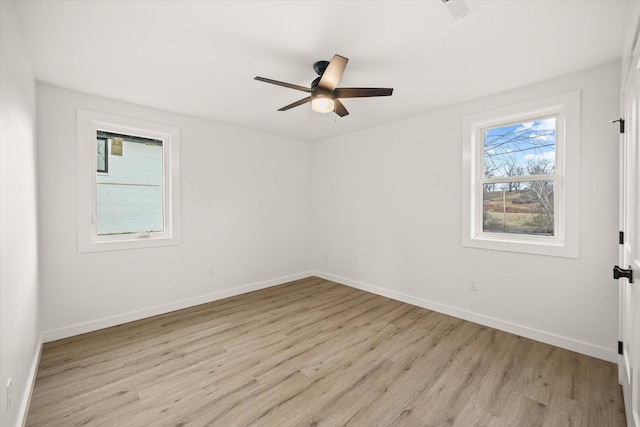 spare room featuring ceiling fan and light hardwood / wood-style floors