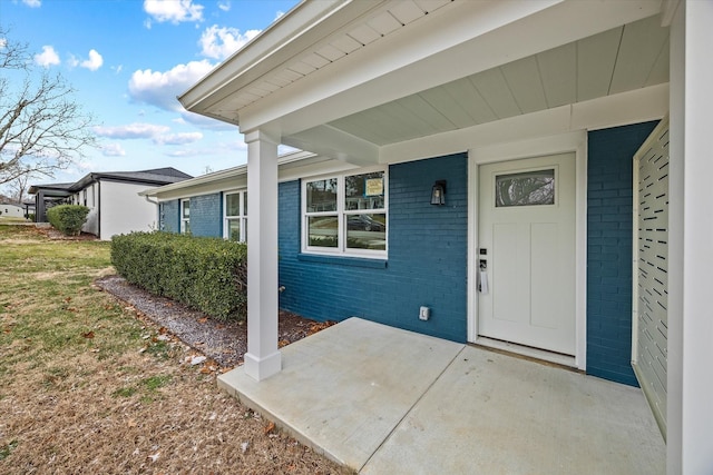 property entrance with a patio area