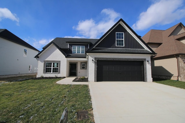 view of front of home with a garage and a front yard