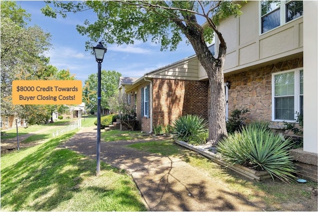 view of property exterior with a lawn