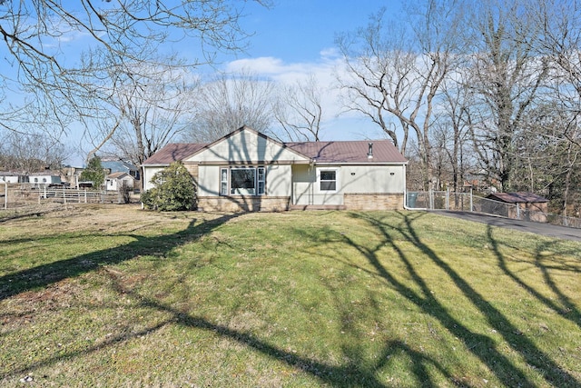 back of house with a yard