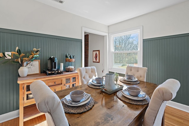 dining space featuring hardwood / wood-style floors