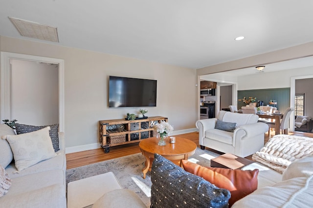 living room with hardwood / wood-style flooring