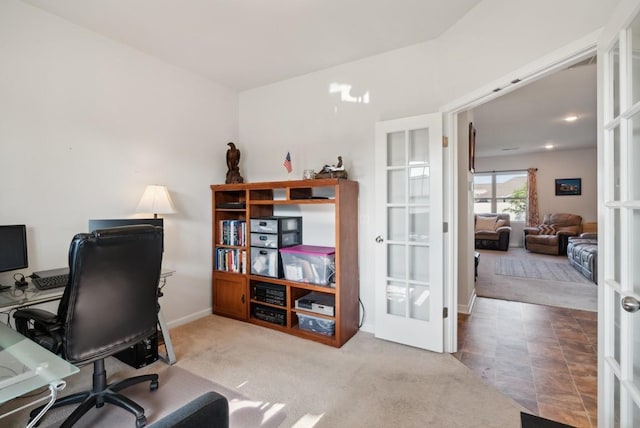 carpeted office featuring french doors