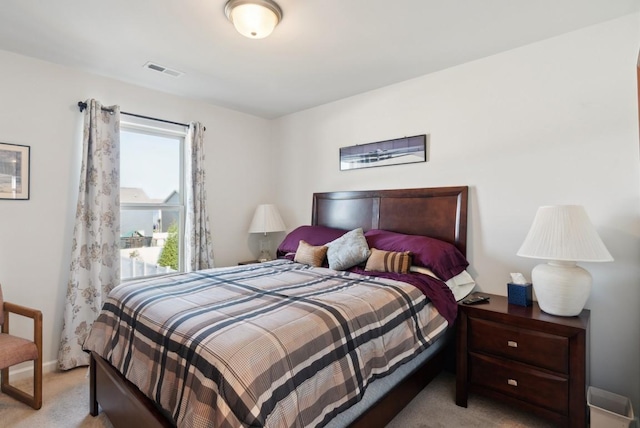 bedroom featuring light colored carpet