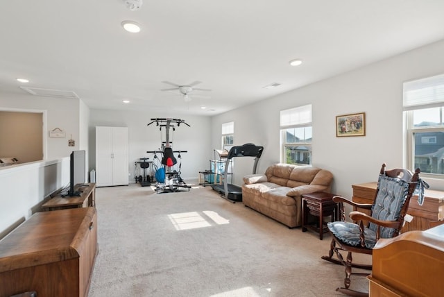 workout area with light carpet and ceiling fan