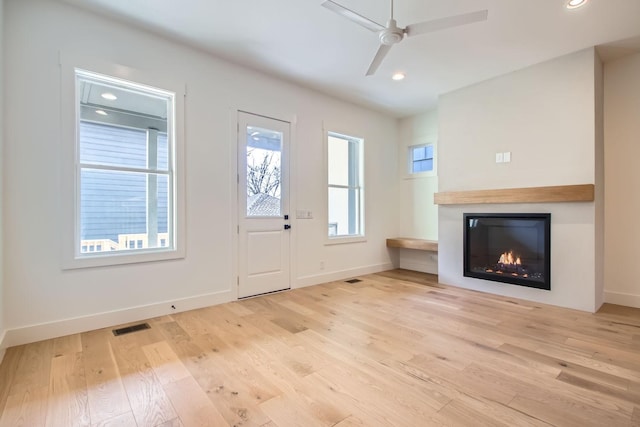 entrance foyer featuring ceiling fan and light hardwood / wood-style flooring