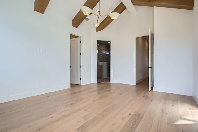 spare room featuring beamed ceiling, high vaulted ceiling, and light wood-type flooring