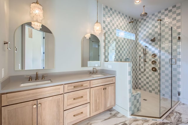 bathroom with vanity and a shower with shower door