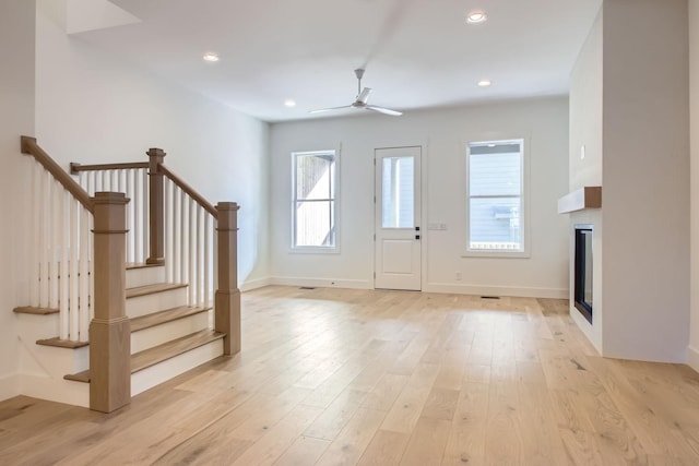 entrance foyer featuring ceiling fan and light wood-type flooring