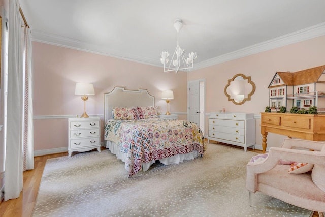 bedroom with ornamental molding, a notable chandelier, and light wood-type flooring