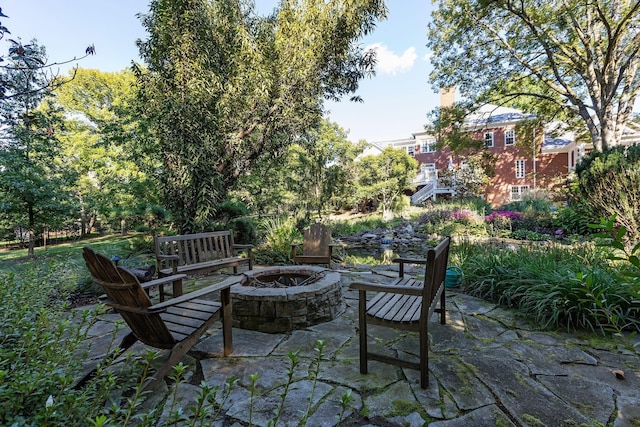 view of patio / terrace featuring an outdoor fire pit