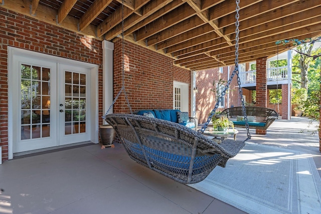 view of patio / terrace with french doors and an outdoor living space