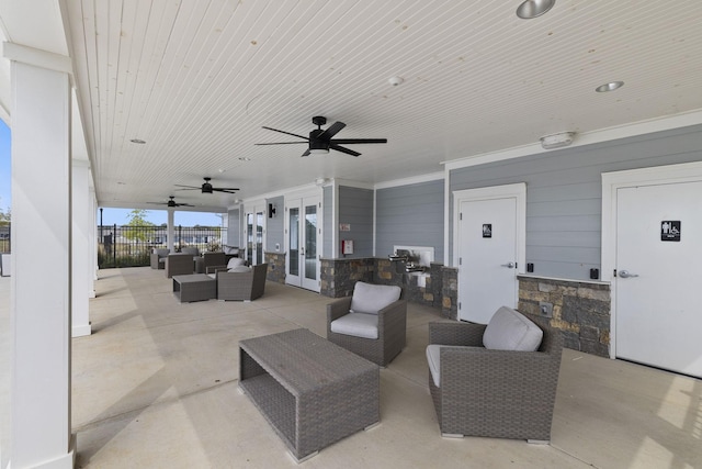 view of patio / terrace with outdoor lounge area, ceiling fan, and french doors