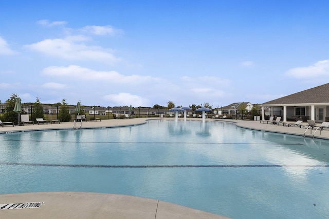 view of swimming pool with a patio