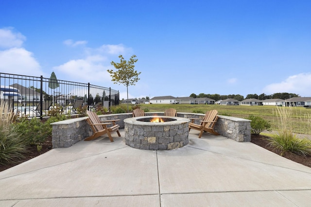 view of patio with a fire pit